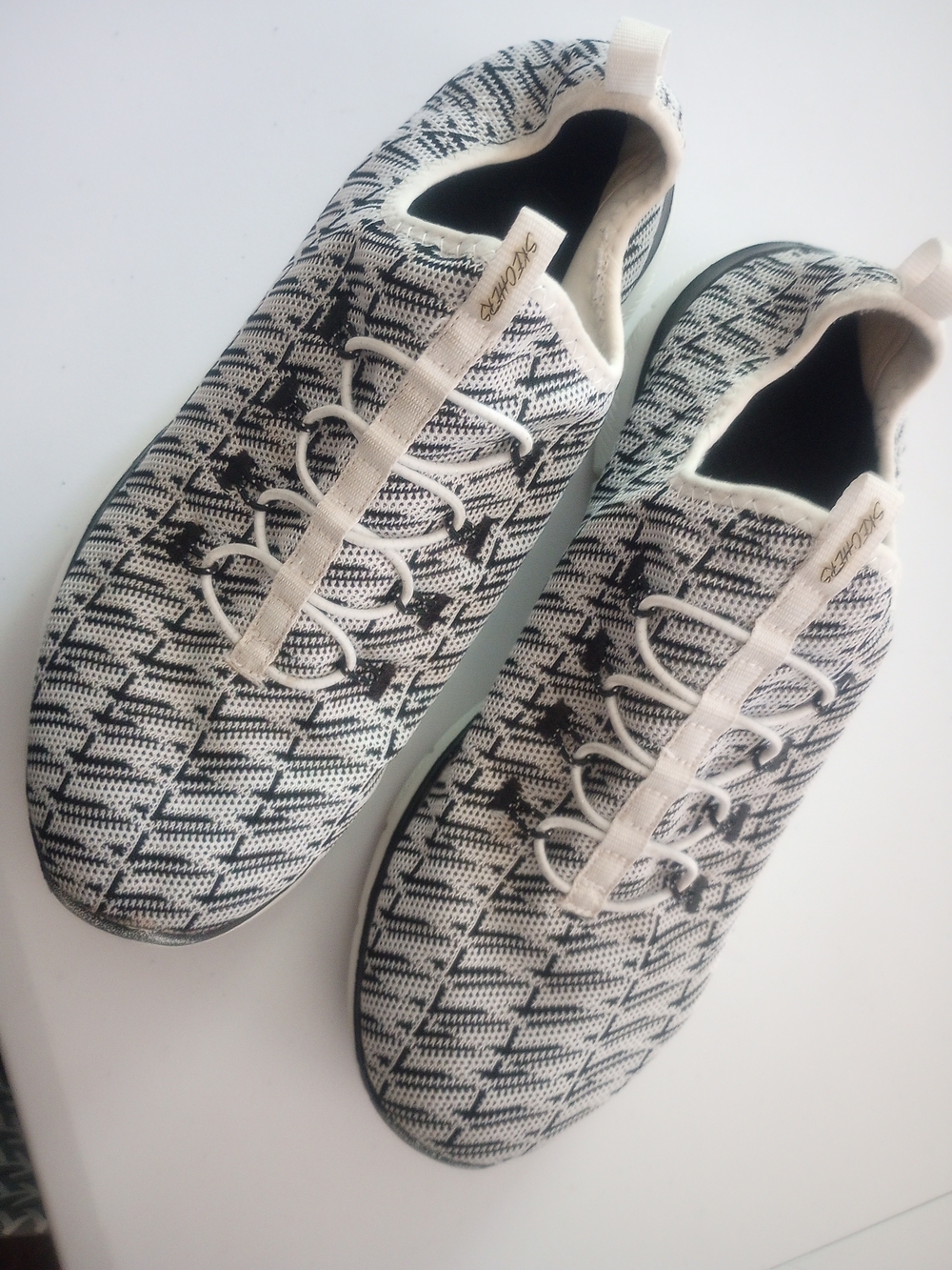 Skechers Women’s Black & White Knit Slip-On Sneakers with Ivory Accents